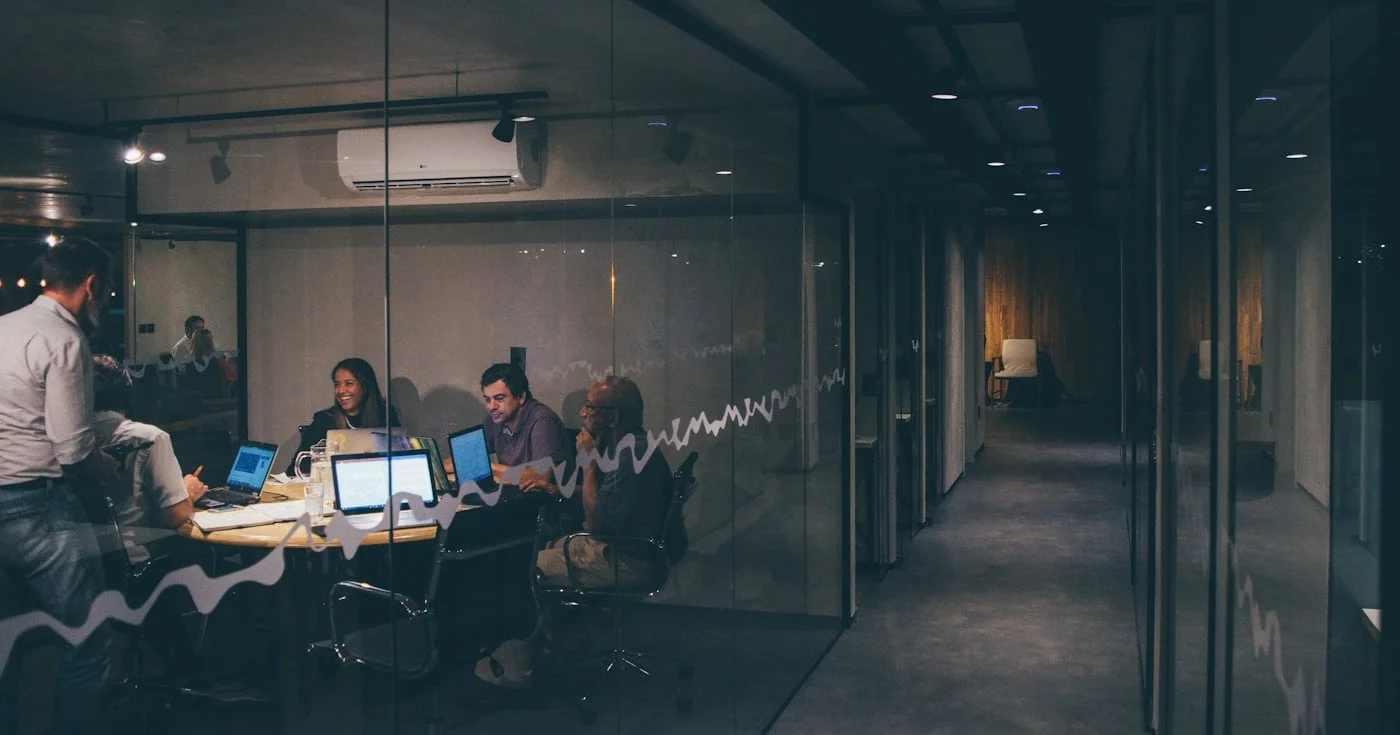 Revenue operations team meeting in a glass conference room